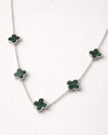 Necklace with green clover-shaped pendants on a white background