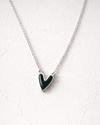 Necklace with a green heart pendant on a white background