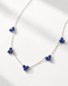 Necklace with blue beads on a white background