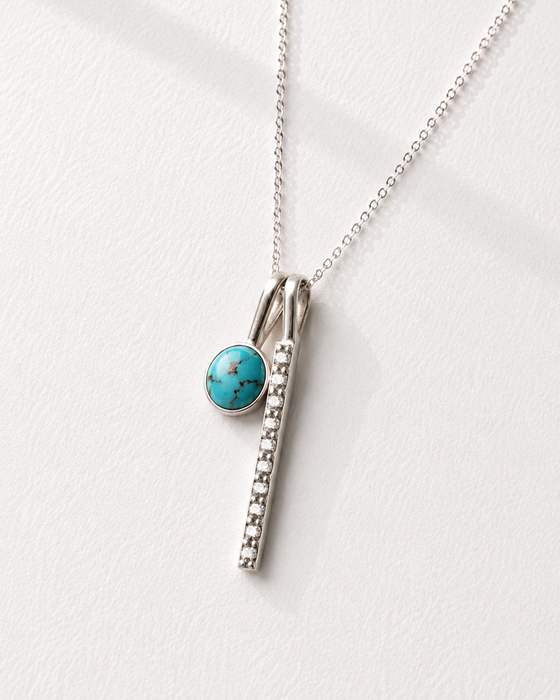 Necklace with a turquoise pendant on a white background