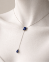 Necklace with a blue pendant on a mannequin