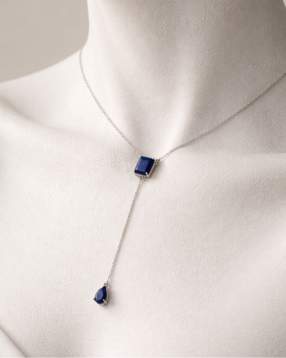 Necklace with a blue pendant on a mannequin