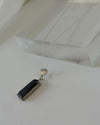 Necklace with two pendant stones on a white background